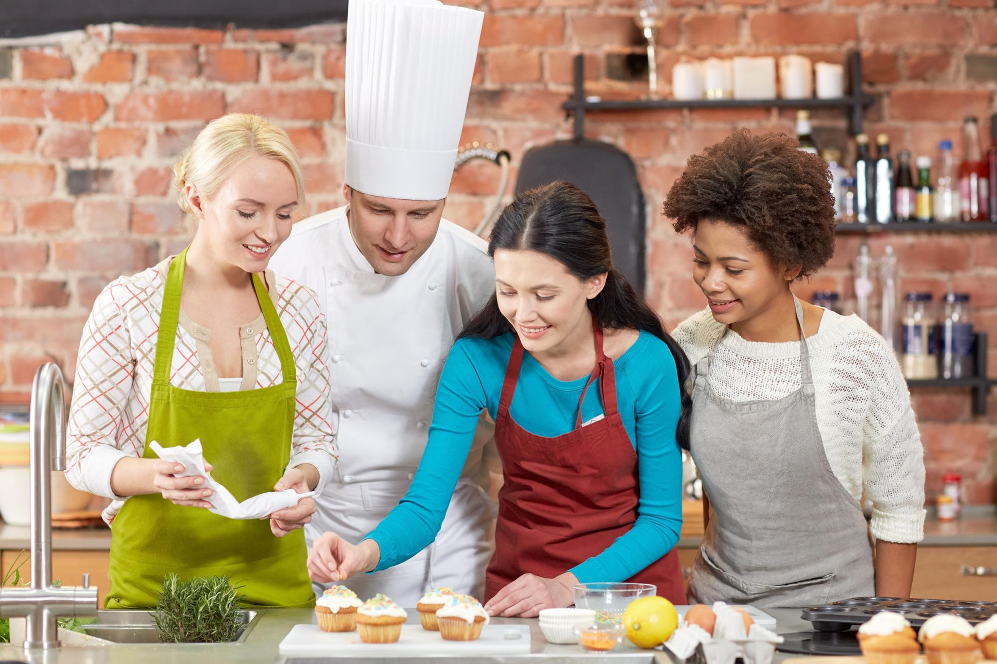 Students cooking together in a studio